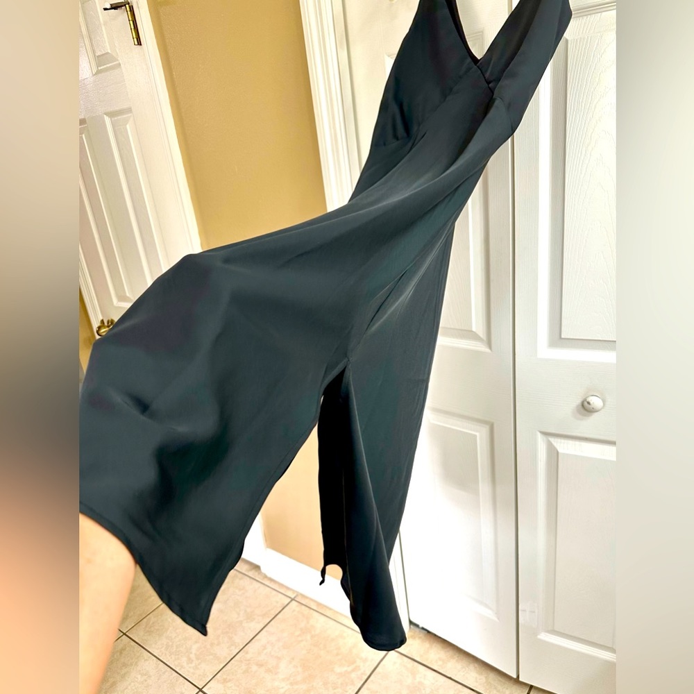 Perfect for a night out black sleeveless dress in size XS and M Length 44” long.